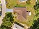 Aerial view of a single Gathering home with a brown roof and a well-manicured lawn at 640 Floridian Dr, Kissimmee, FL 34758