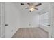 A bright and airy bedroom with wood floors, ceiling fan and modern blinds at 640 Floridian Dr, Kissimmee, FL 34758