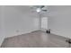Bedroom featuring wood floors, ceiling fan, closet, and a window with blinds at 640 Floridian Dr, Kissimmee, FL 34758