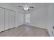 Bedroom with wood floors, ceiling fan, window with blinds, and closet at 640 Floridian Dr, Kissimmee, FL 34758