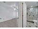Bedroom with wood floors, ceiling fan, closet, and entry to a full bathroom at 640 Floridian Dr, Kissimmee, FL 34758