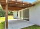 Covered patio with string lights and sliding glass doors at 640 Floridian Dr, Kissimmee, FL 34758