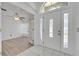 Open foyer with white-tiled floor and views to a living room at 640 Floridian Dr, Kissimmee, FL 34758