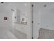 View of the open-concept kitchen with granite countertops and white tile flooring at 640 Floridian Dr, Kissimmee, FL 34758