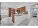 View of kitchen with wood cabinets, stainless steel appliances, and stone countertops at 640 Floridian Dr, Kissimmee, FL 34758