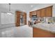 Kitchen with stainless steel appliances, ample storage, granite countertops, and white tile flooring at 640 Floridian Dr, Kissimmee, FL 34758