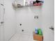 Inside the laundry room with white walls and white tile flooring with utility hookups at 640 Floridian Dr, Kissimmee, FL 34758