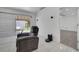 Living room features comfortable recliner, sliding door, and a view into a bedroom space at 640 Floridian Dr, Kissimmee, FL 34758
