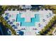 Aerial view of a luxurious community pool with ample seating and well-maintained landscaping at 7770 Sandy Ridge Dr # 142, Kissimmee, FL 34747