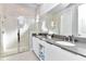 Elegant bathroom with a glass-enclosed shower, double vanity, and modern fixtures at 7770 Sandy Ridge Dr # 142, Kissimmee, FL 34747