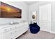 Bright bedroom featuring a wall-mounted TV and a comfortable seating area at 7770 Sandy Ridge Dr # 142, Kissimmee, FL 34747