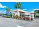 Modern building exterior featuring tropical landscaping and inviting entrance, perfect for vacationers and residents at 7770 Sandy Ridge Dr # 142, Kissimmee, FL 34747