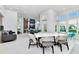 Bright common area with stylish furniture, large windows and a table and chairs at 7770 Sandy Ridge Dr # 142, Kissimmee, FL 34747