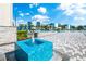 Inviting pool deck with fountain feature, surrounded by palm trees and ample lounge seating, great for relaxing by the pool at 7770 Sandy Ridge Dr # 142, Kissimmee, FL 34747