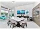 Welcoming game room, offering ample seating, stylish decor, and plenty of natural light from large windows overlooking the pool at 7770 Sandy Ridge Dr # 142, Kissimmee, FL 34747