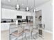 Bright kitchen with stainless steel appliances, pendant lighting, and a breakfast bar with seating for three at 7770 Sandy Ridge Dr # 142, Kissimmee, FL 34747