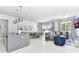 Bright, open floor plan with a modern kitchen, dining area, and comfortable living space at 7770 Sandy Ridge Dr # 142, Kissimmee, FL 34747