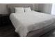 Well-lit bedroom with a comfortable bed and neutral decor at 8121 Fan Palm Way, Kissimmee, FL 34747