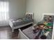 bedroom featuring twin beds with bright Toy Story-themed bedding and decor at 8121 Fan Palm Way, Kissimmee, FL 34747