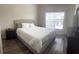 Inviting bedroom with a large window and comfortable furnishings at 8121 Fan Palm Way, Kissimmee, FL 34747