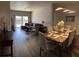 Open-concept living and dining area with stylish decor and ample natural light at 8121 Fan Palm Way, Kissimmee, FL 34747