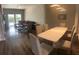 Open living space with modern dining set and a cozy seating area at 8121 Fan Palm Way, Kissimmee, FL 34747
