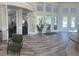 Spacious lobby with plenty of natural light and attractive views of the grounds at 8121 Fan Palm Way, Kissimmee, FL 34747