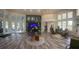 Well-lit lobby featuring tropical plants and access to community amenities at 8121 Fan Palm Way, Kissimmee, FL 34747