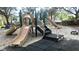 Community playground with slides and climbing structure on a sand base at 8121 Fan Palm Way, Kissimmee, FL 34747