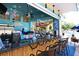 Community poolside bar features a casual setup with a bamboo counter, offering refreshments and a gathering spot at 8121 Fan Palm Way, Kissimmee, FL 34747