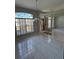 Bright dining area with decorative chandelier, open floor plan, and tile floors at 852 Adour Dr, Kissimmee, FL 34759