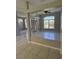 Open floor plan featuring an empty room with tile flooring, neutral walls, and natural light from windows at 852 Adour Dr, Kissimmee, FL 34759