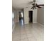 Spacious room with ceramic tile floors, ceiling fan, and easy access to the adjoining rooms and bathroom at 852 Adour Dr, Kissimmee, FL 34759