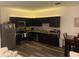 Well-appointed kitchen featuring stainless steel appliances, granite countertops, and wood cabinetry at 892 Grandin St, Davenport, FL 33837