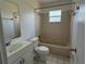 Bathroom featuring a sink, toilet, and bathtub at 925 Derbyshire Dr, Kissimmee, FL 34758