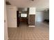 Open floor plan with tile flooring leading to the kitchen at 925 Derbyshire Dr, Kissimmee, FL 34758
