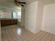 Spacious main bedroom with tile flooring, neutral walls, and an en-suite bathroom featuring a vanity and tub at 925 Derbyshire Dr, Kissimmee, FL 34758