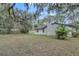 Beautiful home with a large backyard surrounded by mature trees at 9905 Nicoma Ln, Orlando, FL 32817