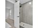 Renovated bathroom features gray tile and a modern shower at 9905 Nicoma Ln, Orlando, FL 32817