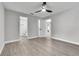 This bedroom has a ceiling fan and views of the adjacent bathroom at 9905 Nicoma Ln, Orlando, FL 32817