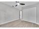 Bedroom features a ceiling fan and closet at 9905 Nicoma Ln, Orlando, FL 32817
