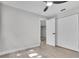 Bedroom with a ceiling fan and closet for ample storage space at 9905 Nicoma Ln, Orlando, FL 32817
