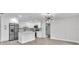 Modern kitchen featuring stainless steel appliances, sleek island, and open floor plan at 9905 Nicoma Ln, Orlando, FL 32817