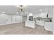 Open kitchen with stainless steel appliances, stylish island, and modern lighting at 9905 Nicoma Ln, Orlando, FL 32817