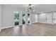 Open living room with large windows providing ample natural light and smooth flooring at 9905 Nicoma Ln, Orlando, FL 32817