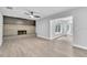 Comfortable living room featuring a fireplace and an open layout towards the yard and entrance at 9905 Nicoma Ln, Orlando, FL 32817