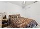 Bedroom with a queen size bed, bedside table, and floral bedding that creates a cozy and restful atmosphere at 1526 Ferendina Dr, Deltona, FL 32725