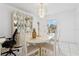Dining room with a marble table, chandelier, and display cabinet at 1526 Ferendina Dr, Deltona, FL 32725