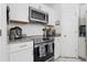 Close up of kitchen with stainless steel appliances and granite countertops at 1526 Ferendina Dr, Deltona, FL 32725