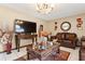 Cozy living room with elegant furnishings and a large flat-screen TV at 1526 Ferendina Dr, Deltona, FL 32725